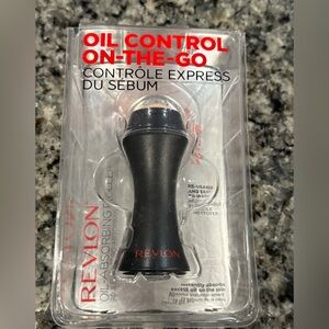New in package- Revlon oil-absorbing volcanic roller